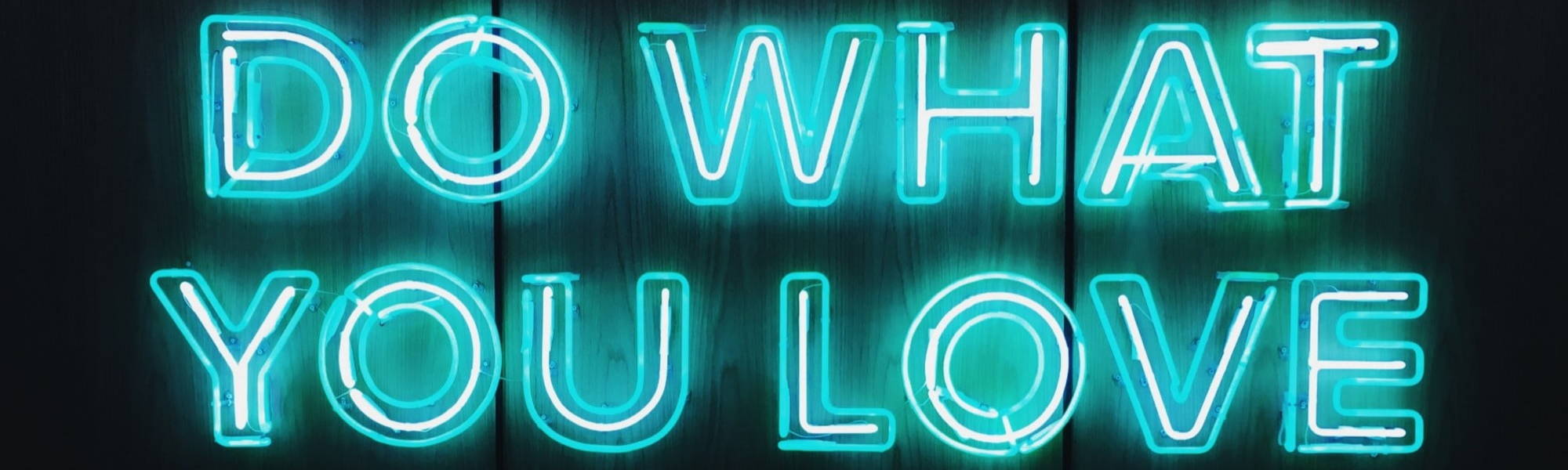 Do What You Love in blue neon writing